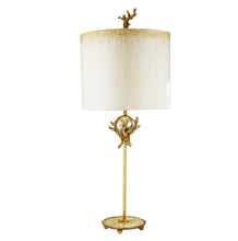Load image into Gallery viewer, The Trellis table lamp is adorned with organic elements and a sculpted branch finial, adding a touch of elegance to the mix of silver and gold.
