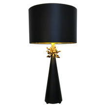 Load image into Gallery viewer, The Anemone Table Lamp features a unique design with its elegant tapered silhouette and distinctive anemone accent. The painted card cylinder shade pairs perfectly to add a touch of elegance to any room.
