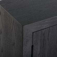 Load image into Gallery viewer, Perfect for any space with its sleek design and timeless finishes. The dark ebony oak veneer is accented by aged gold linear iron pulls. Includes one fixed shelf inside.
