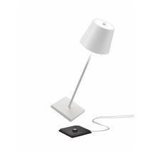 Load image into Gallery viewer, these mini touch lamps are the perfect addition to your nursery. It offers lighting strong enough to see you through those late night feedings or unexpected diaper changes, yet diffused enough to keep little one restful and relaxed. The lamp turns on or off with just a quick tap on the top. Wherever you need it to be, the lamp is truly portable and offers 9+ hours of cordless illumination.
