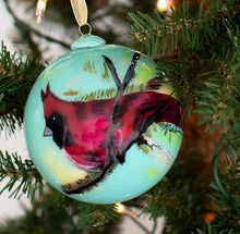 Load image into Gallery viewer, Elevate your holiday decor with Anne Neilson&#39;s exclusive, limited edition Christmas ornaments. Each one is meticulously hand-painted from an original Anne Neilson artwork, making them a unique fusion of art and festive spirit. Share these treasured ornaments with loved ones or keep them as luxurious keepsakes. Ornament is a 3&quot; glass ball with gold ribbon.
