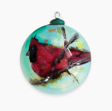 Load image into Gallery viewer, Elevate your holiday decor with Anne Neilson&#39;s exclusive, limited edition Christmas ornaments. Each one is meticulously hand-painted from an original Anne Neilson artwork, making them a unique fusion of art and festive spirit. Share these treasured ornaments with loved ones or keep them as luxurious keepsakes. Ornament is a 3&quot; glass ball with gold ribbon.
