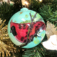 Load image into Gallery viewer, Elevate your holiday decor with Anne Neilson&#39;s exclusive, limited edition Christmas ornaments. Each one is meticulously hand-painted from an original Anne Neilson artwork, making them a unique fusion of art and festive spirit. Share these treasured ornaments with loved ones or keep them as luxurious keepsakes. Ornament is a 3&quot; glass ball with gold ribbon.
