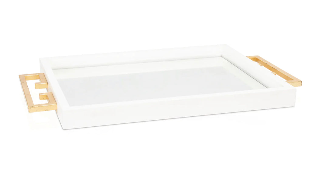 The Avana Tray features a high gloss lacquer finish in black or white, accompanied by a beveled mirror inset and gold leaf iron handles on the sides, making it both decorative and functional.