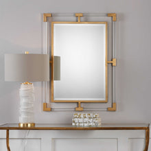 Load image into Gallery viewer, Enhance your living space with the sophisticated and modern style of the Christine mirror. The fusion of forged iron and transparent acrylic creates a striking and contemporary appearance, while the refined metallic gold leaf finish offers a touch of refinement.
