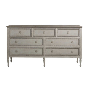 French-style 18th century inspired chest with beaded burlap drawer fronts and carved legs, with an antiqued white finish