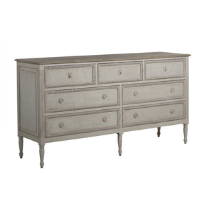 French-style 18th century inspired chest with beaded burlap drawer fronts and carved legs, with an antiqued white finish