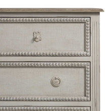 Load image into Gallery viewer, French-style 18th century inspired chest with beaded burlap drawer fronts and carved legs, with an antiqued white finish
