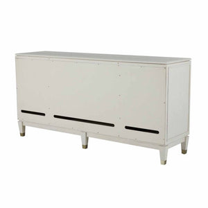 Contemporary ribbed-front cabinet in a white cerused finish with champagne hardware accents.