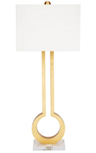 The Guthrie Table Lamp boasts an elegant design, featuring an open key design and lucite base, topped with a white linen shade. It's a stunning addition to any room, providing both style and functionality.