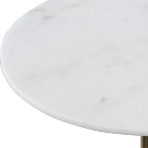 Expertly crafted from honed white marble and a sleek brushed brass metal base, the Trumpet Accent Table showcases the natural beauty of its materials with individual variations in marbling and veining. 