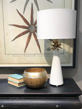 Load image into Gallery viewer, The Anemone Table Lamp features a unique design with its elegant tapered silhouette and distinctive anemone accent. The painted card cylinder shade pairs perfectly to add a touch of elegance to any room.
